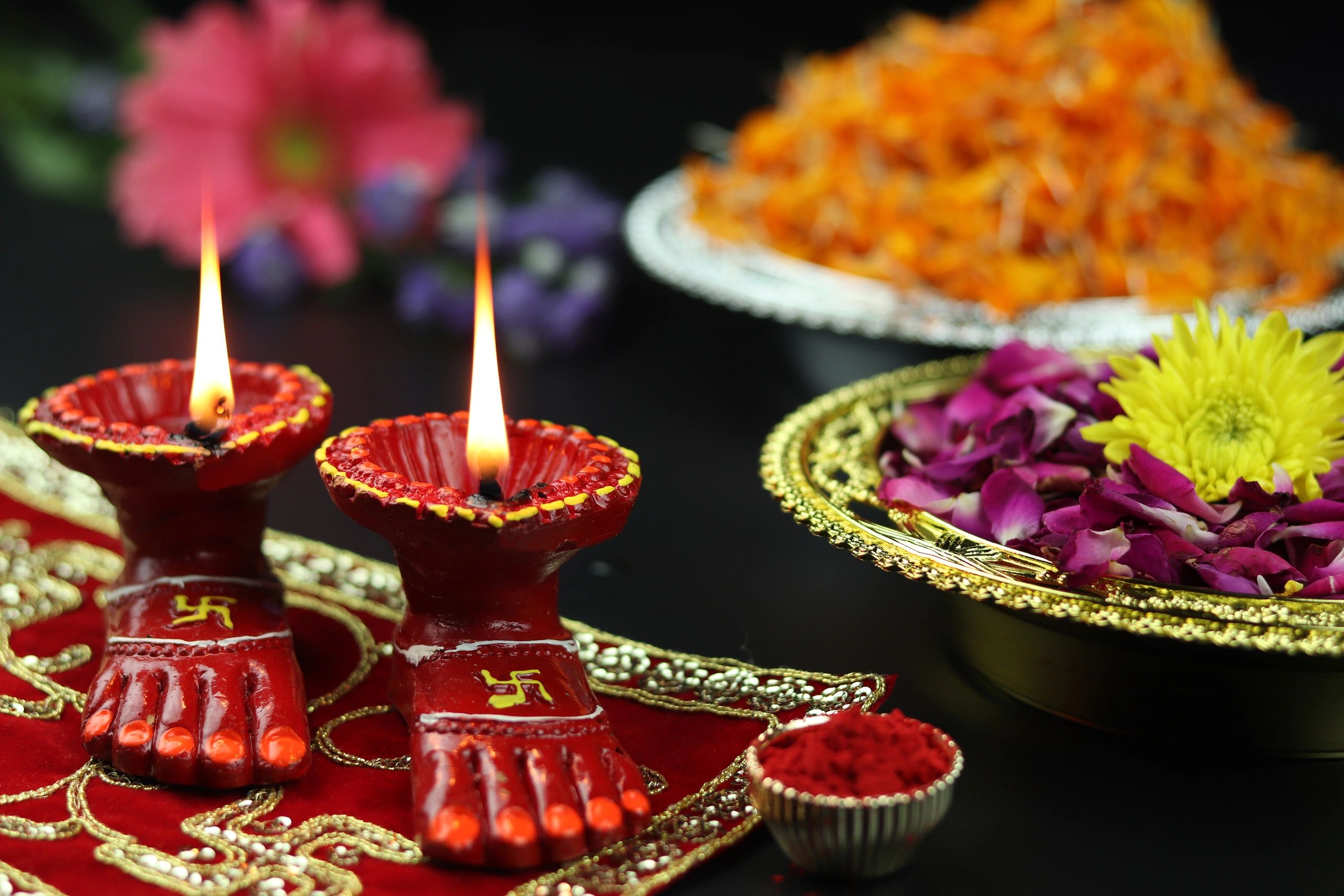 Lit diya arranged for festive pooja display