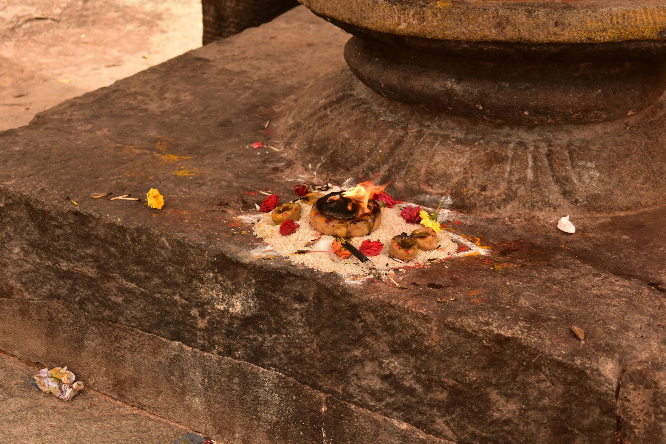 Traditional oil lamp near a sacred temple setting