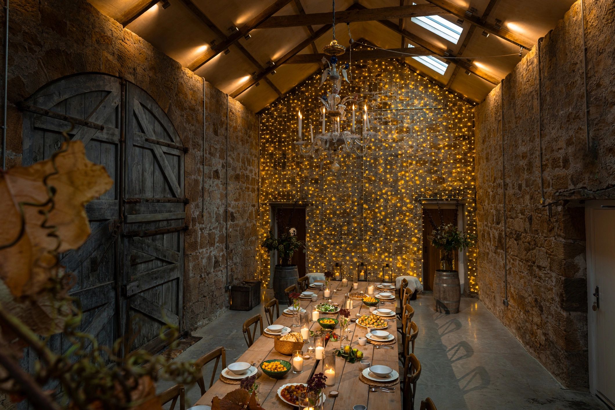 Warm festive table styling with candles and handcrafted decor